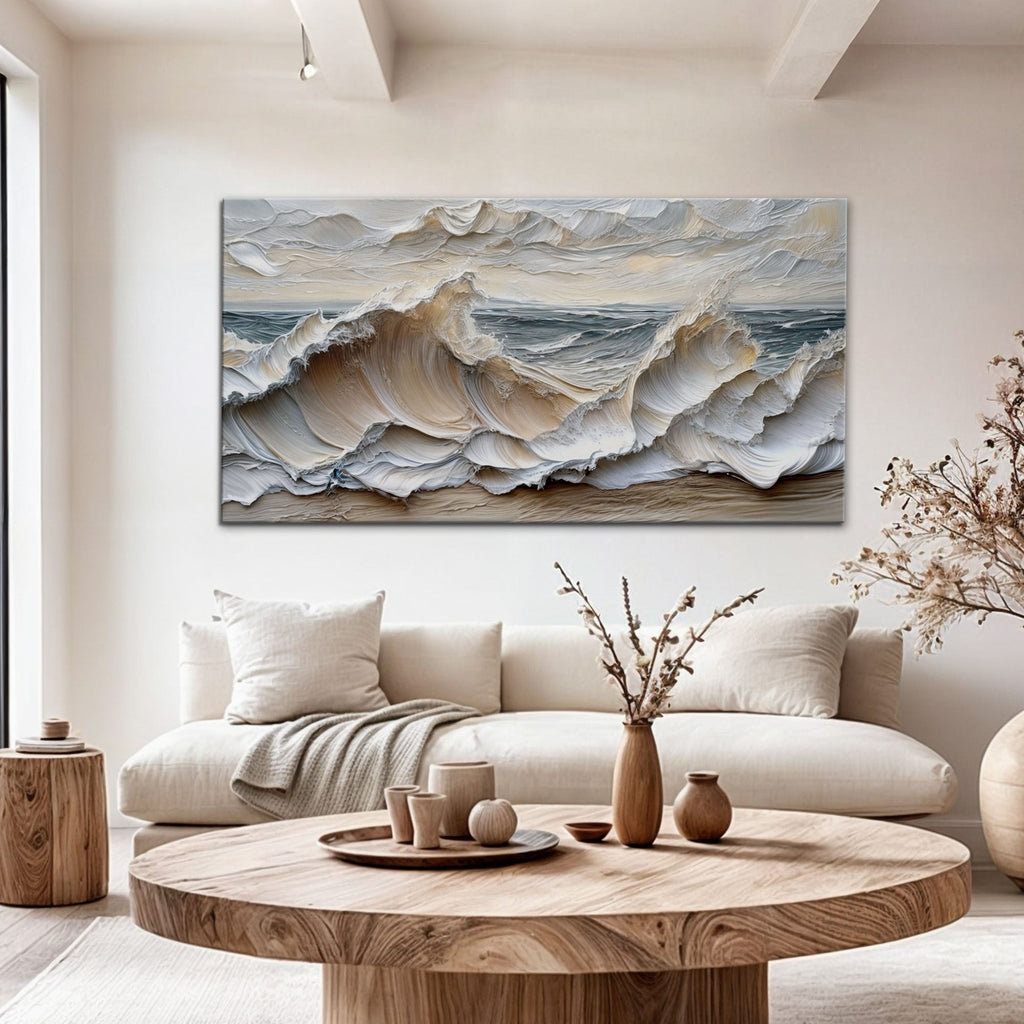 Living room with a large abstract painting of waves on the wall, a beige sofa, and a wooden coffee table.