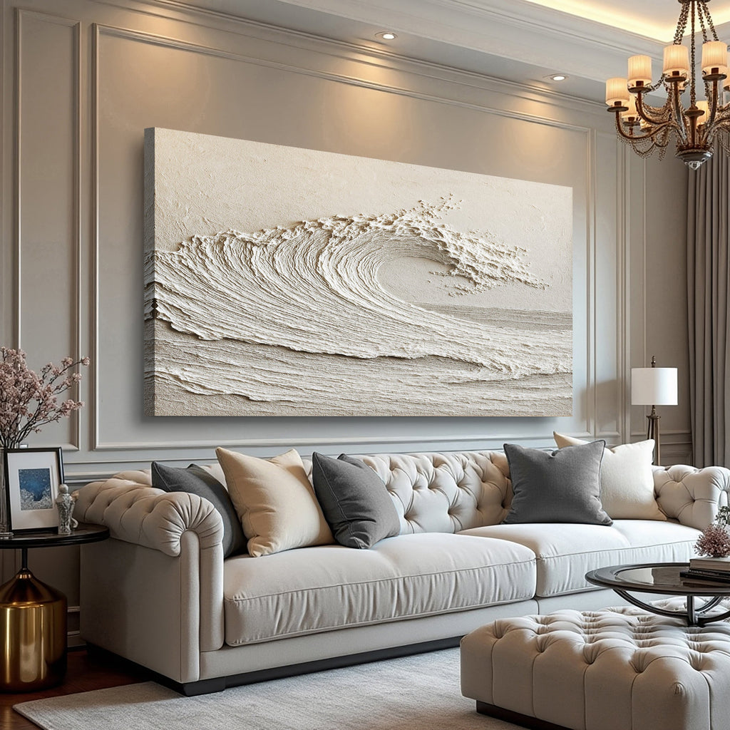Living room with a large abstract wave wall art, a white sofa with pillows, and a chandelier.
