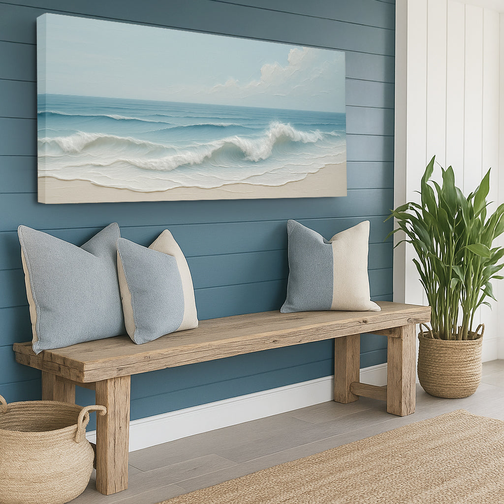 Nautical-themed room with a wooden bench, pillows, and a beach painting on a blue wall.