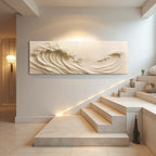 Modern interior with a large abstract wall art piece of waves above a staircase.