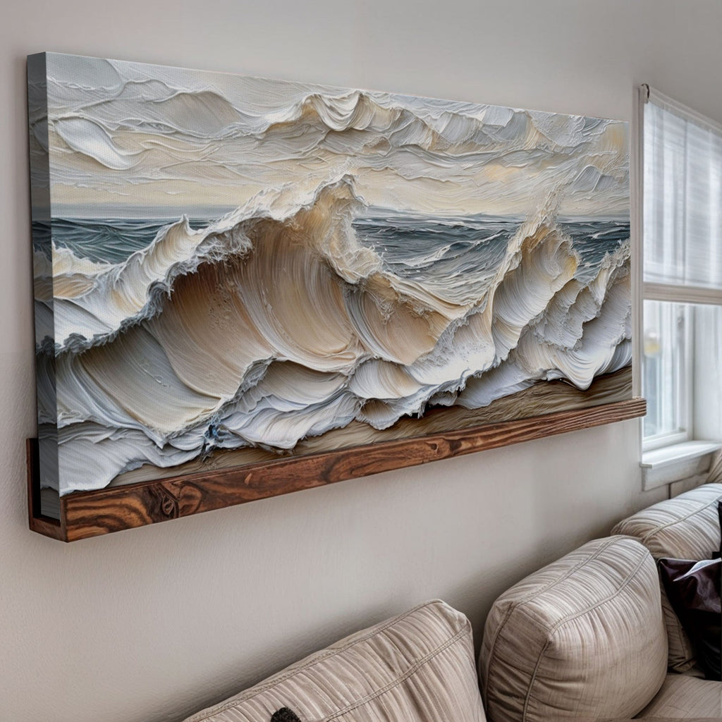 Large abstract painting of ocean waves on a wall above a sofa.
