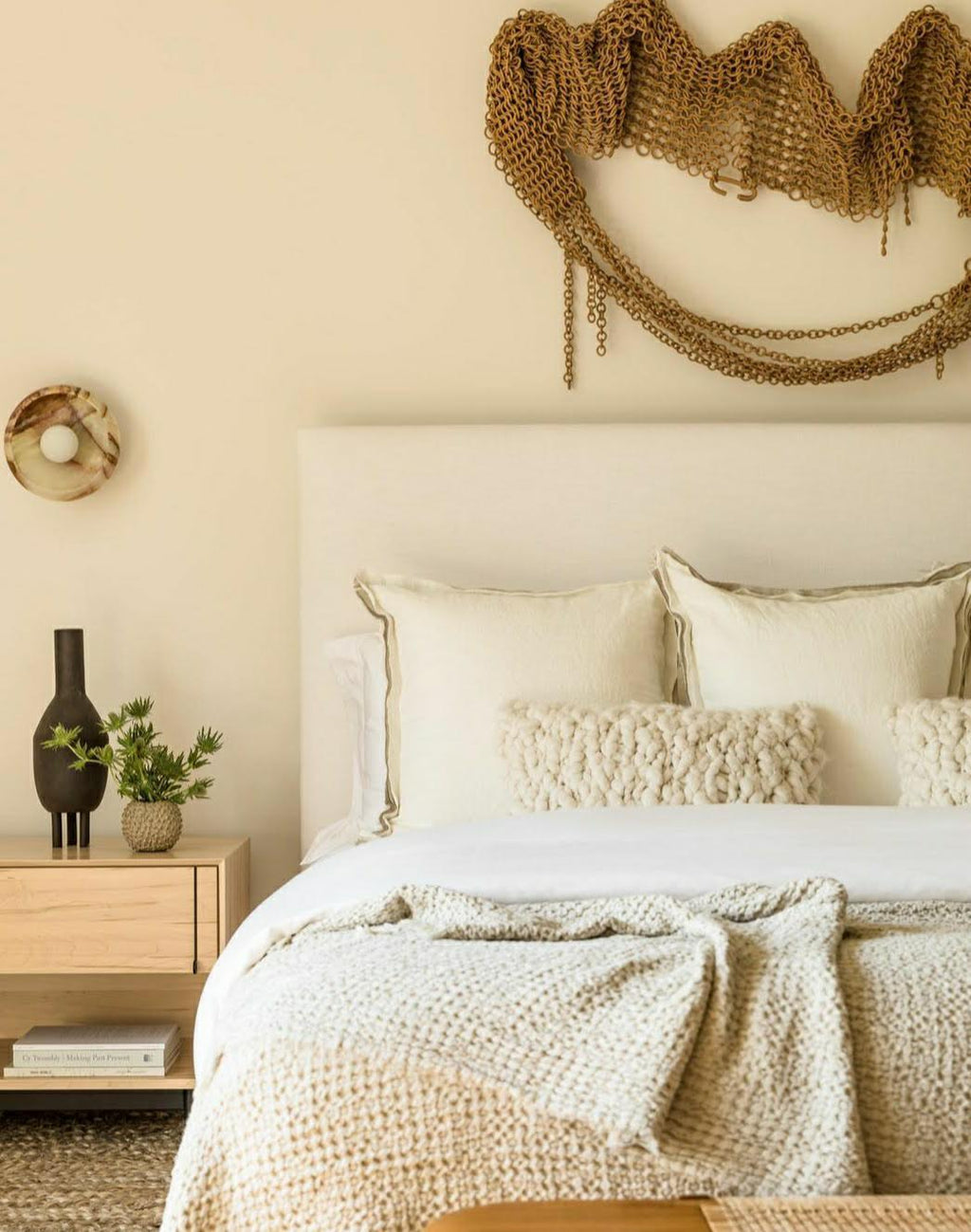 Cozy bedroom with a bed, nightstand, and decorative pillows