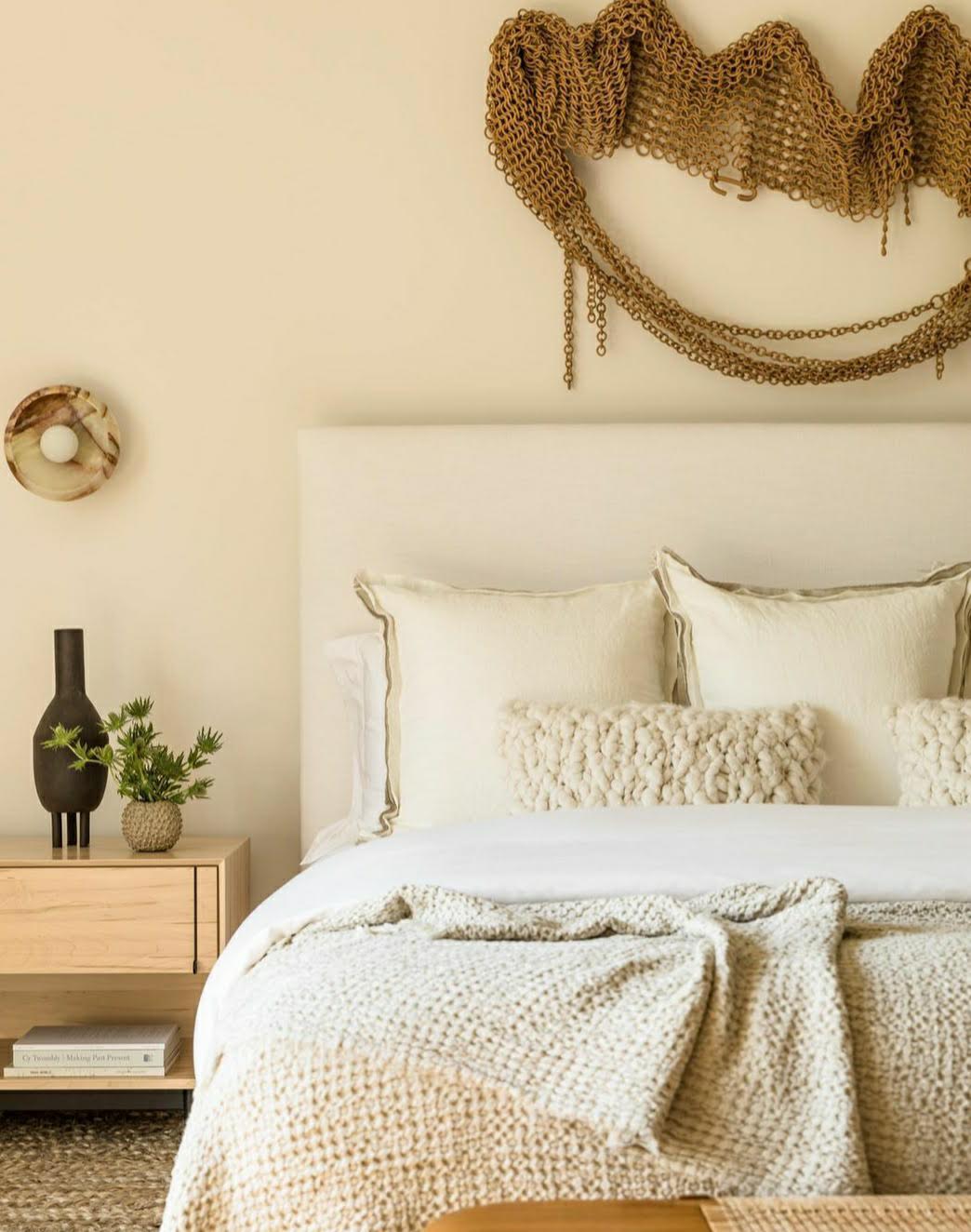Cozy bedroom with a bed, nightstand, and decorative pillows