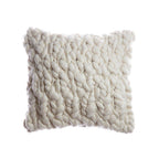 Textured natural ivory pillow on a white background