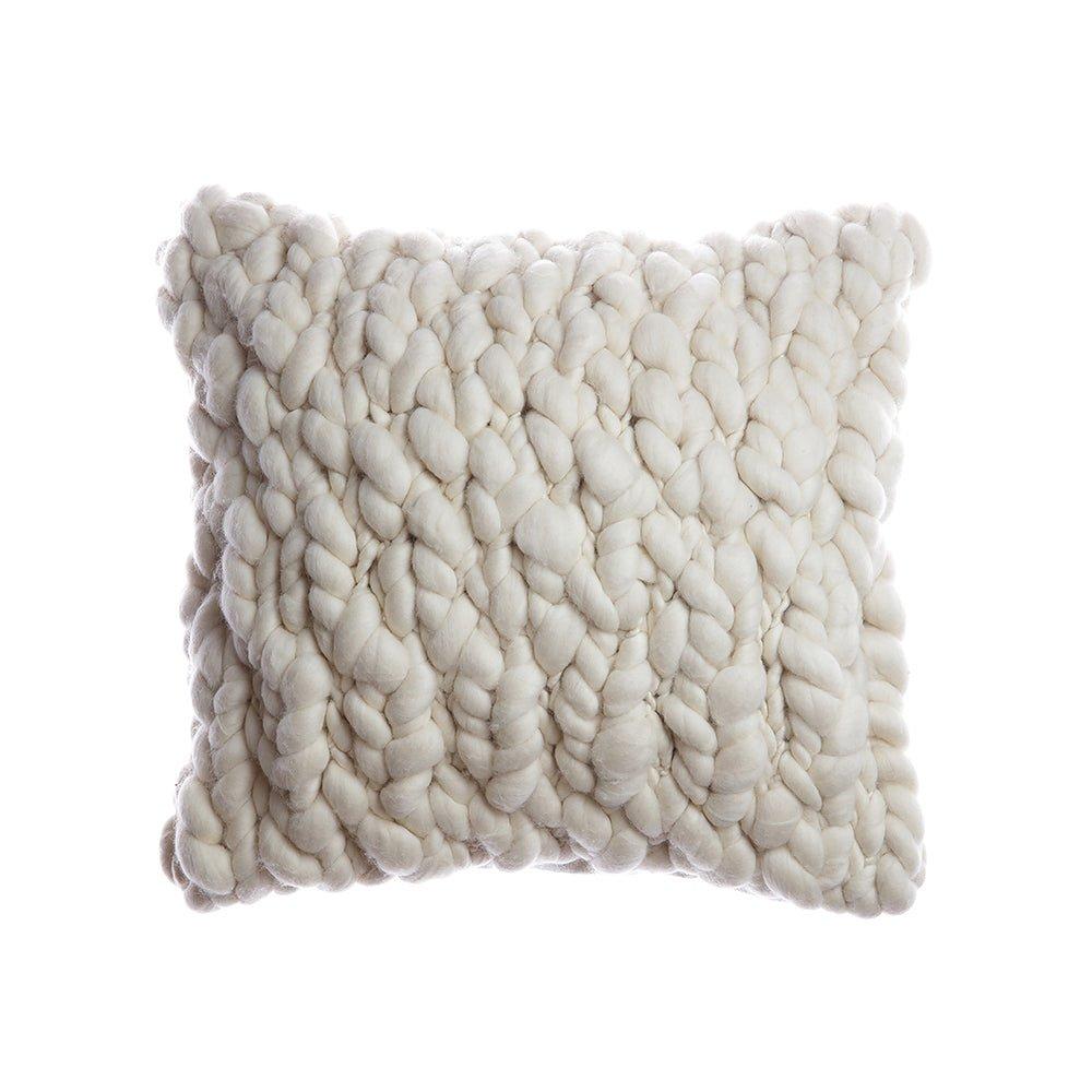 Textured natural ivory pillow on a white background