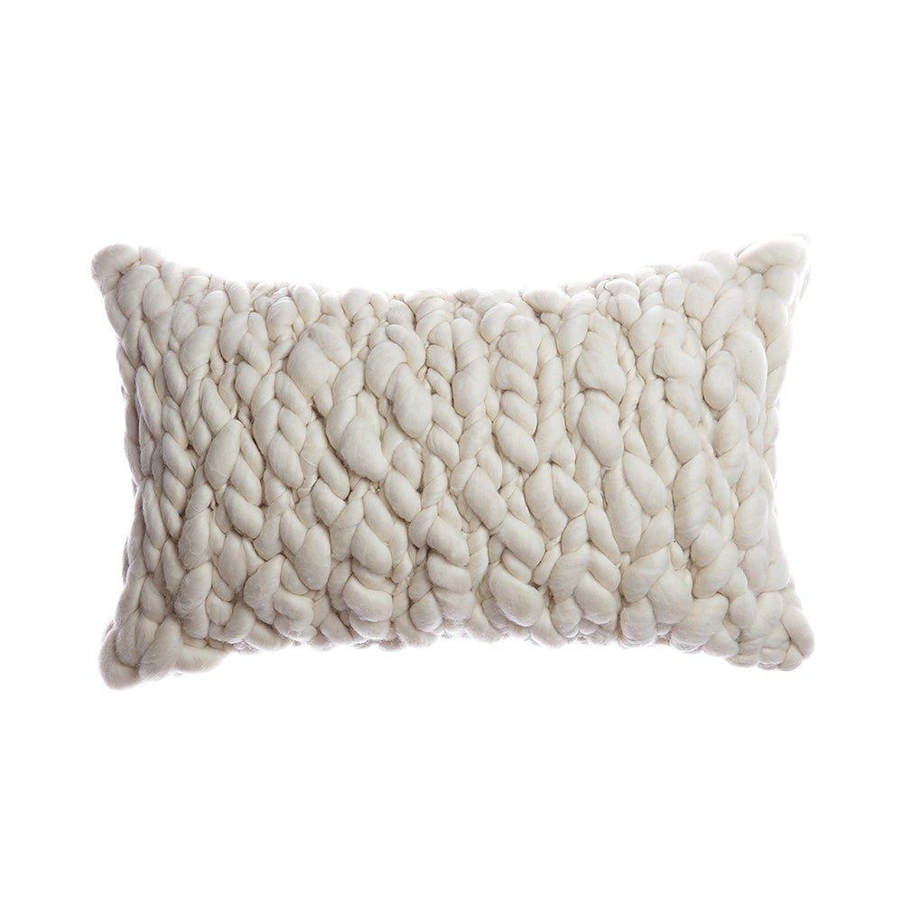 Textured natural ivory pillow on a white background