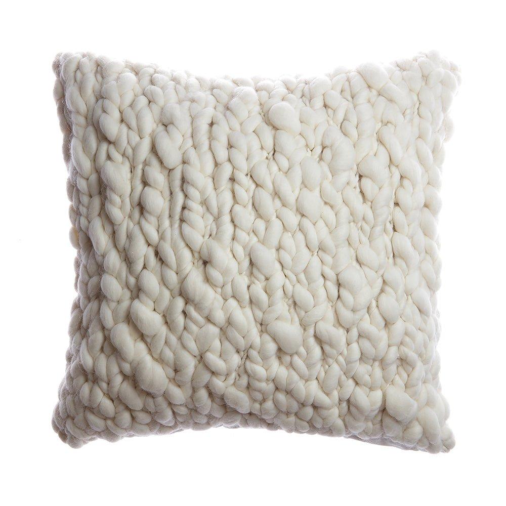 Textured white pillow on a white background
