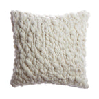 Textured white pillow on a white background