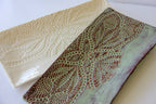 Two ceramic platters with textured surfaces on a white background
