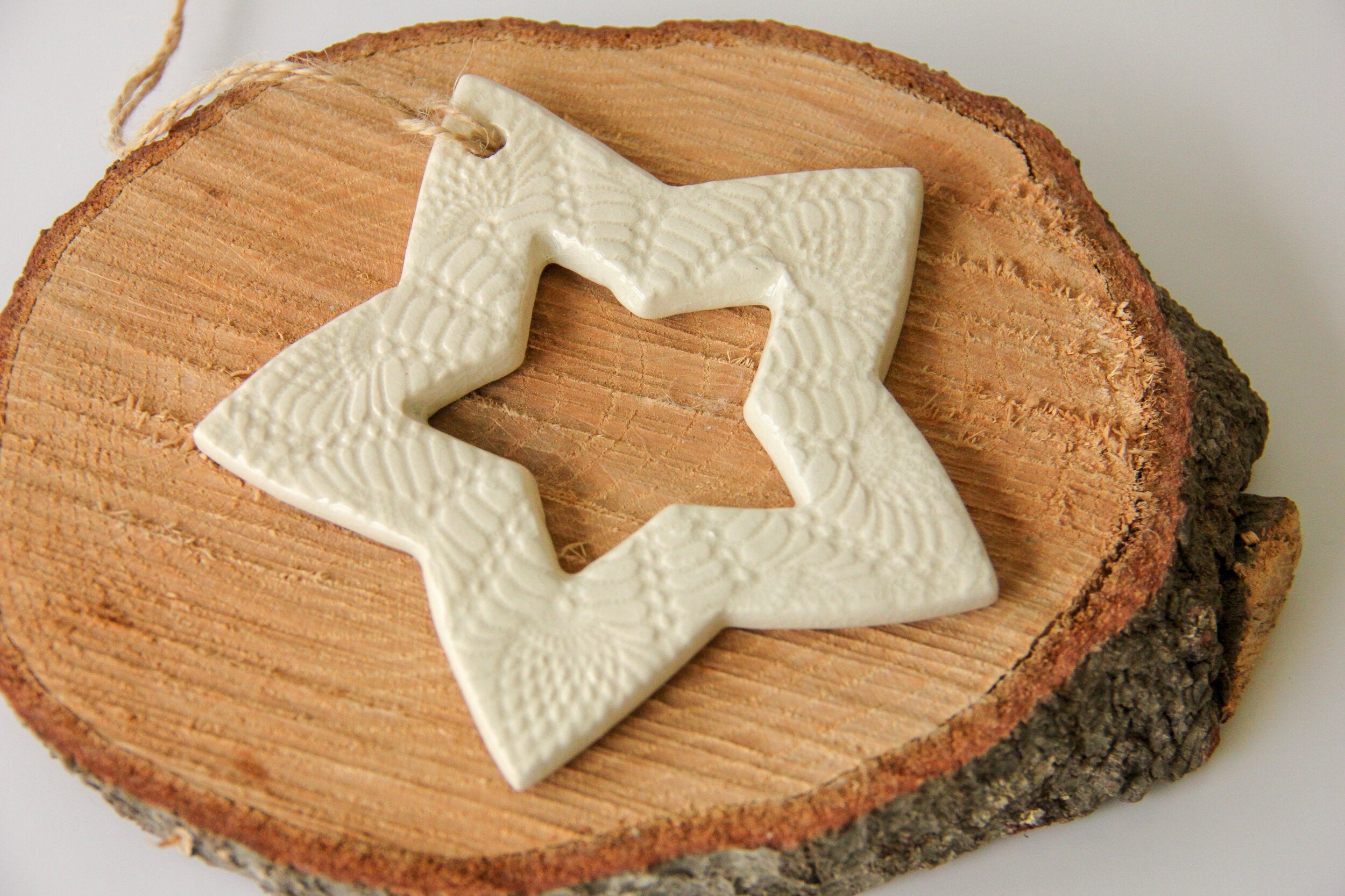 Star-shaped ceramic ornament on a wooden surface