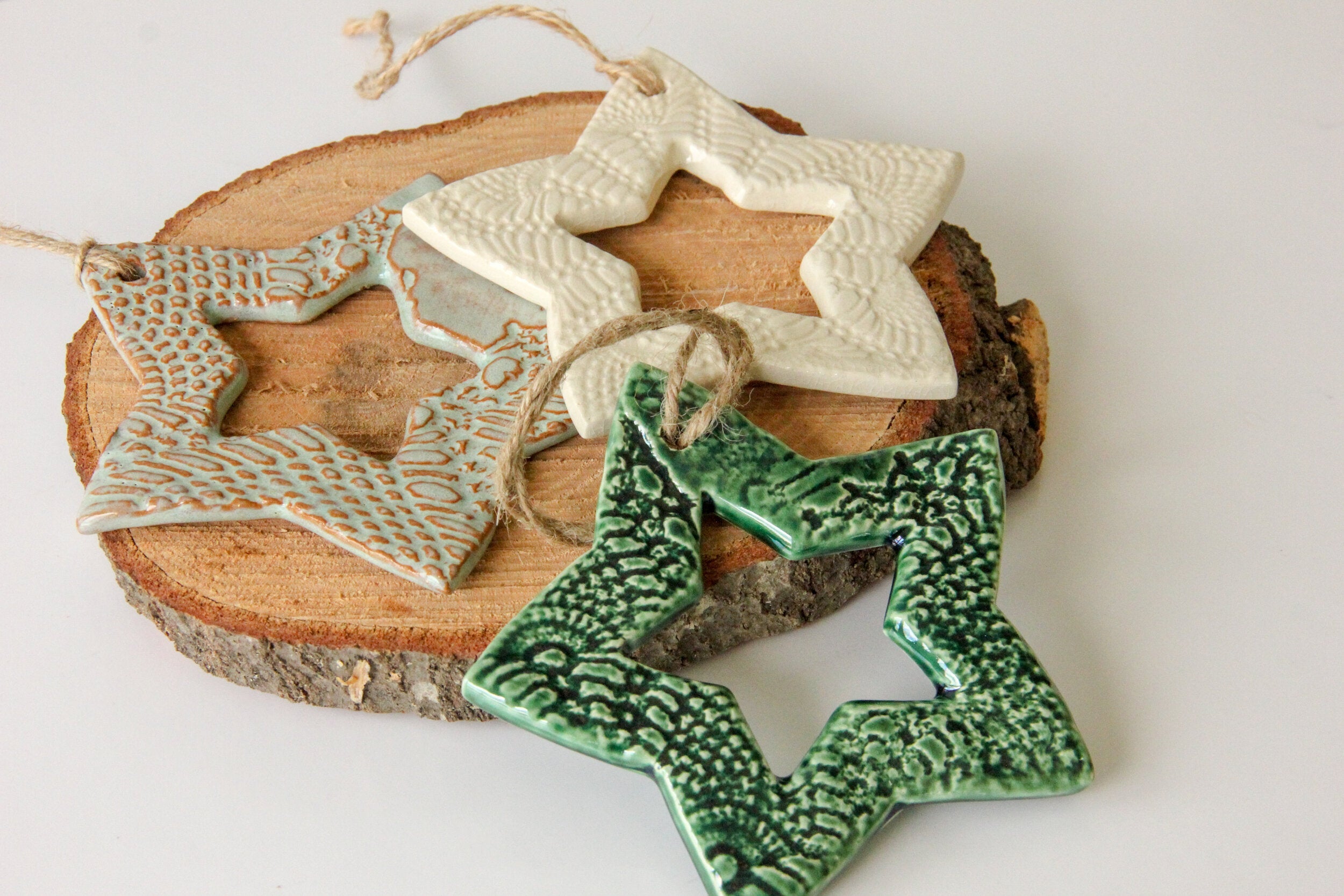 Decorative ceramic stars ornaments on a wooden surface