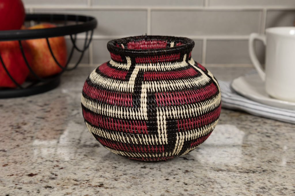 Woven basket with geometric pattern on a kitchen counter