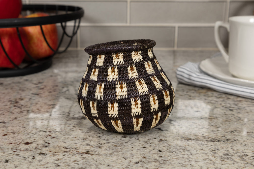 Woven basket with geometric pattern on a kitchen counter
