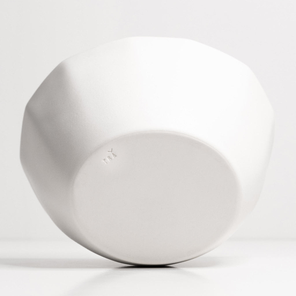 White ceramic bowl bottom 
on a light gray background