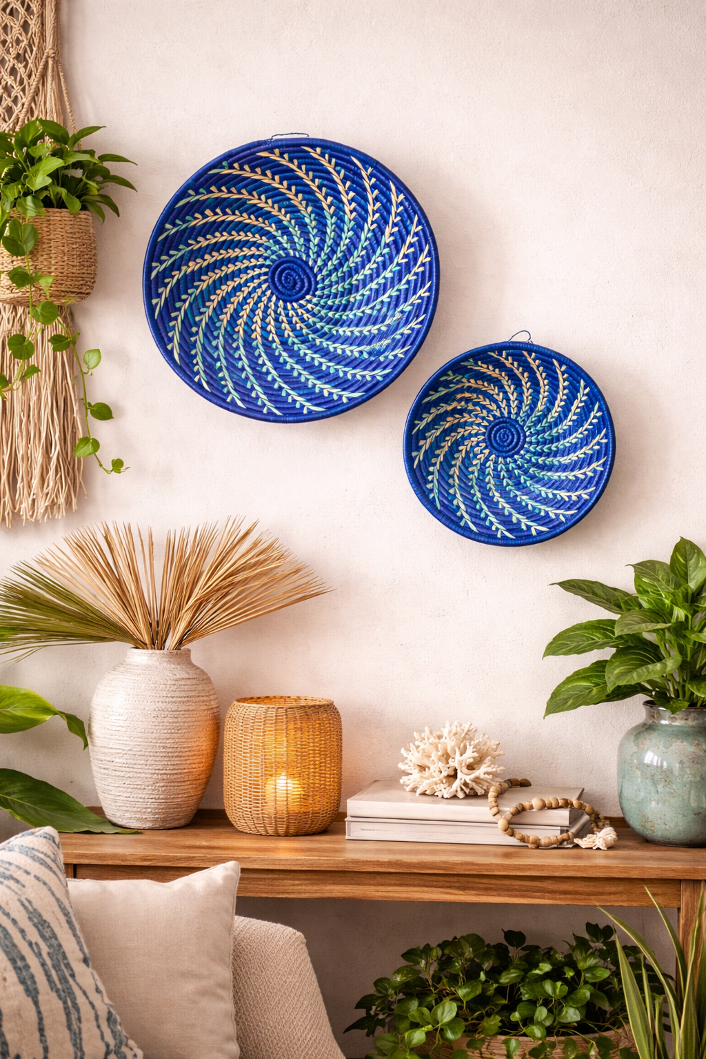 Decorative blue spiral plates on a wall with a wooden console table and home decor items.