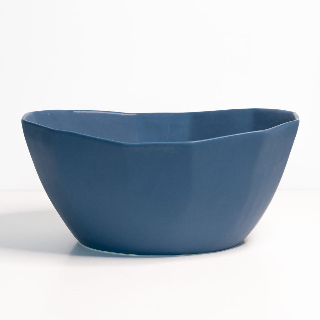 Blue ceramic bowl on a white background